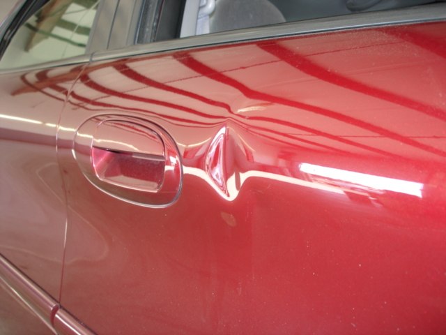 Large door dent before PDR repair Premium Dent Repair Ontario